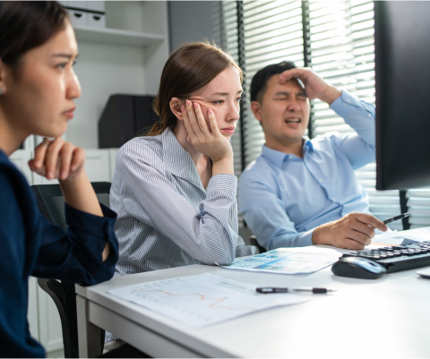 people stressed out in front of a computer